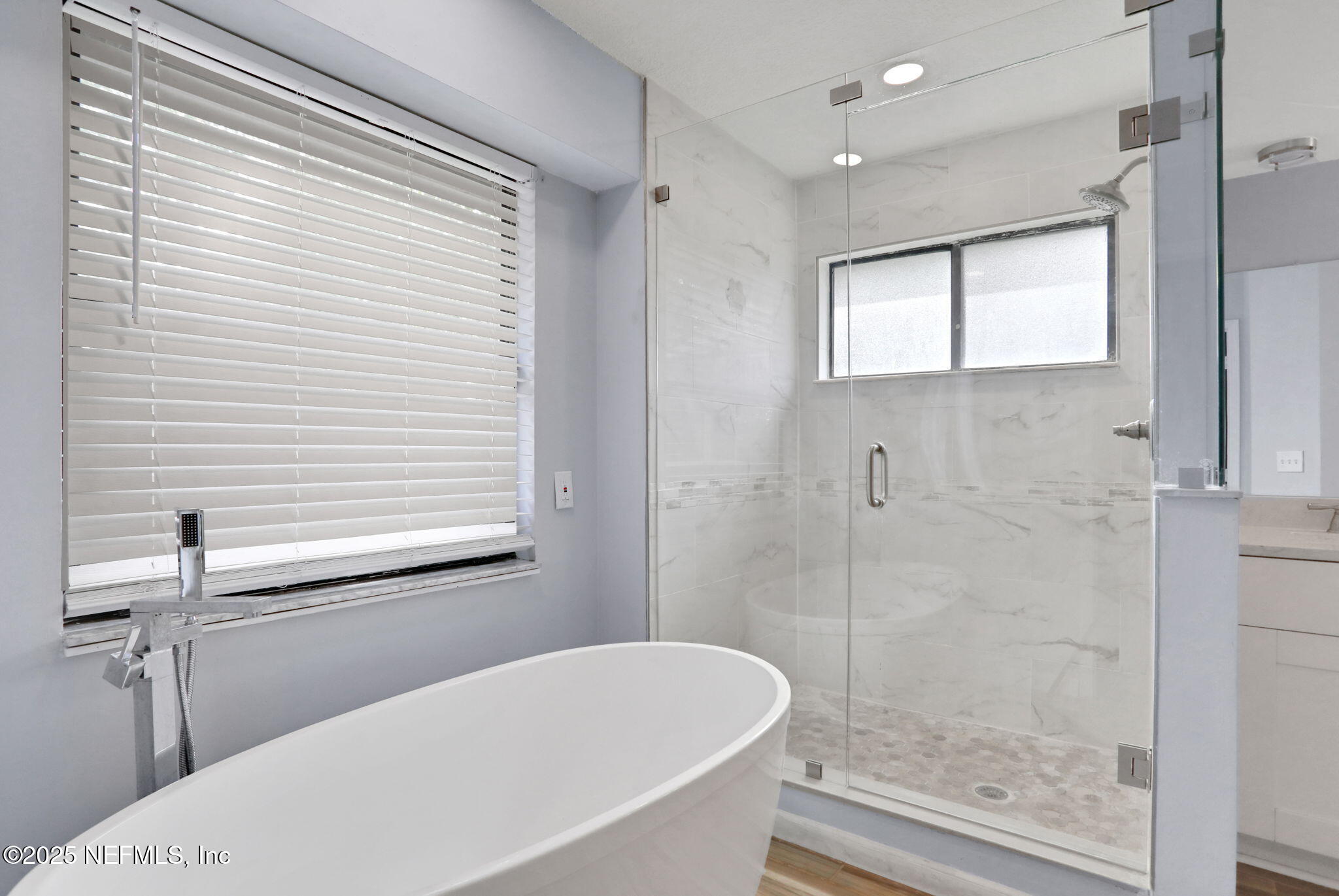 12228 Smoke Ridge Circle South Jacksonville, FL 32225 - Photo 30 of 50 a bathroom with a bathtub and a shower