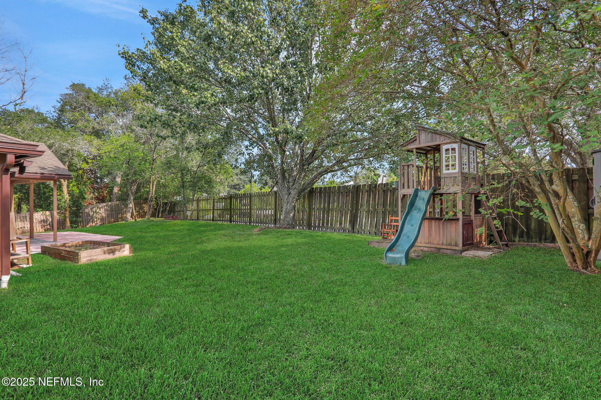 12228 Smoke Ridge Circle South Jacksonville, FL 32225 - Photo 3 of 50 a view of a house with a backyard and a slide