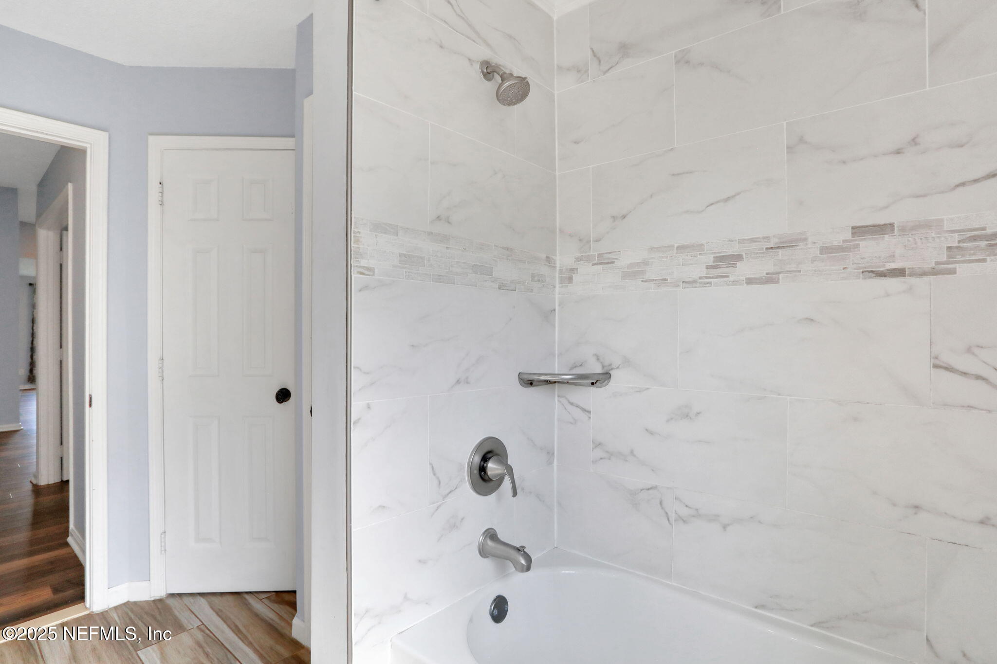 12228 Smoke Ridge Circle South Jacksonville, FL 32225 - Photo 40 of 50 a bathroom with a bathtub