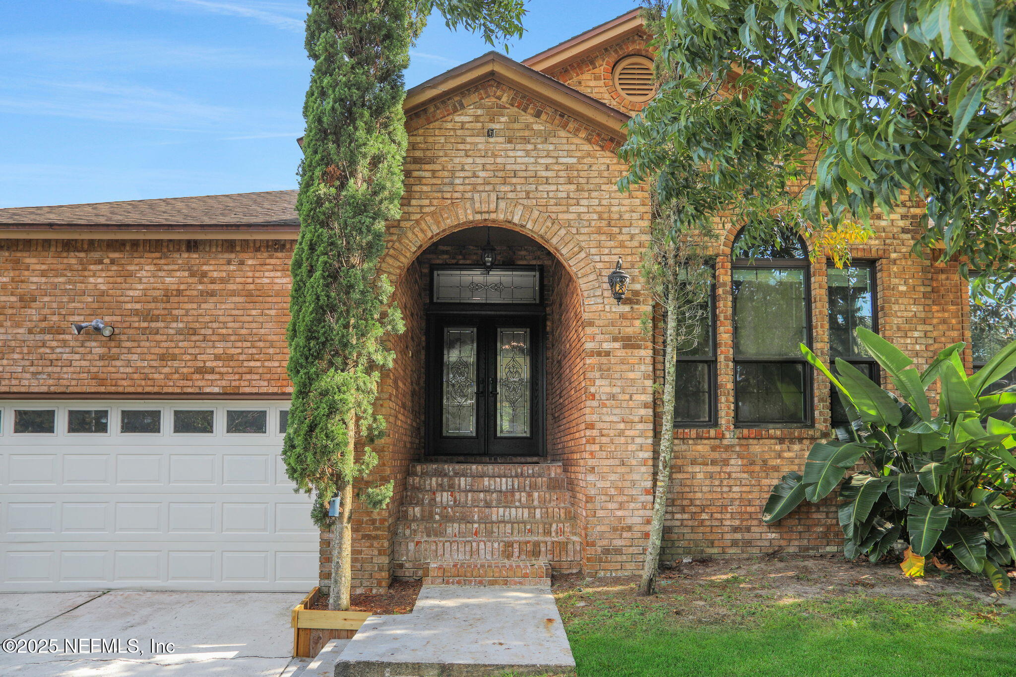 12228 Smoke Ridge Circle South Jacksonville, FL 32225 - Photo 4 of 50 a front view of a house with garden