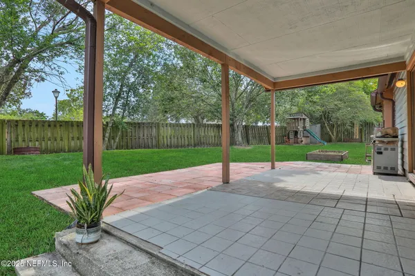 a view of a garden with patio