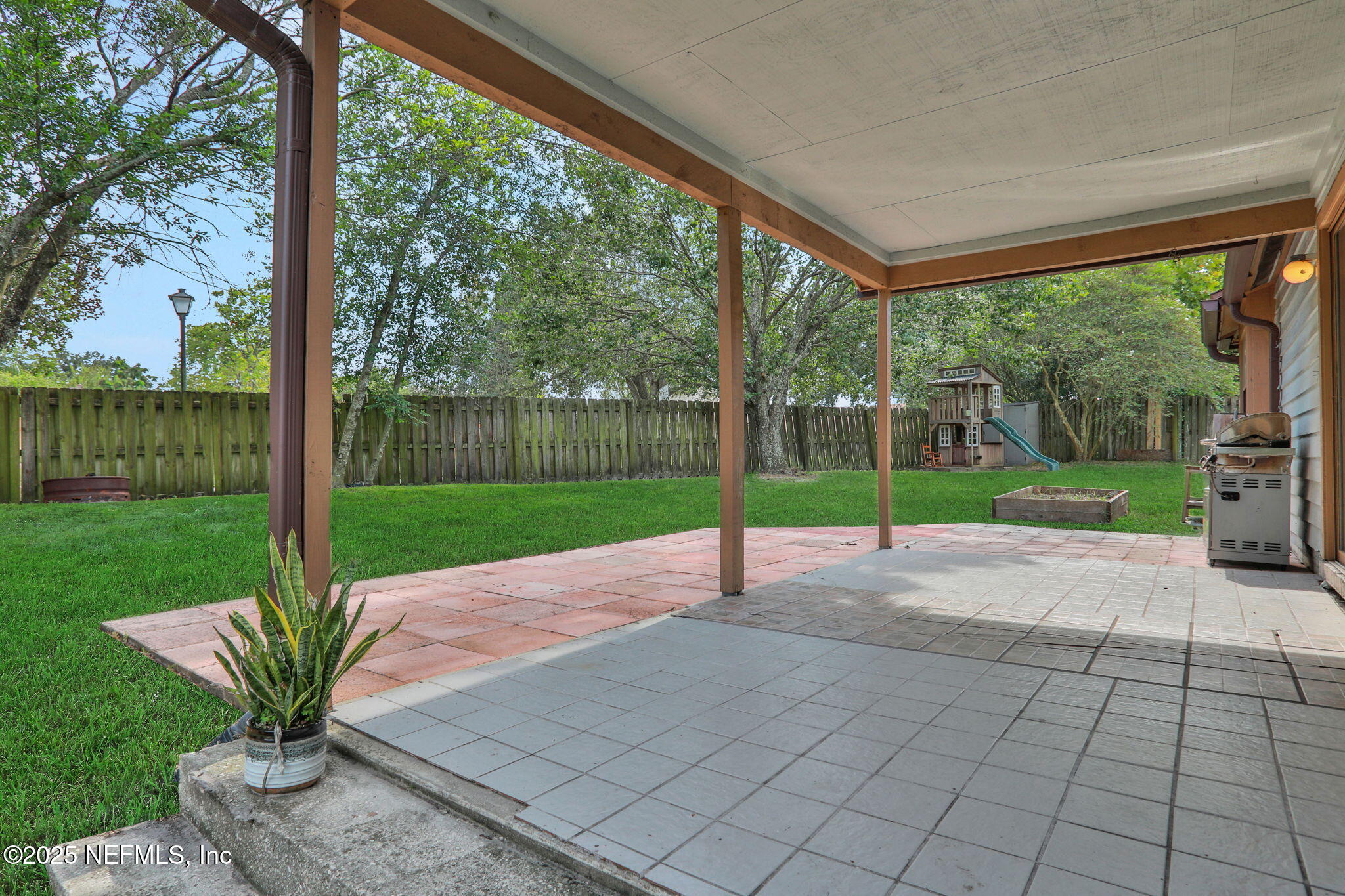 12228 Smoke Ridge Circle South Jacksonville, FL 32225 - Photo 46 of 50 a view of a garden with patio