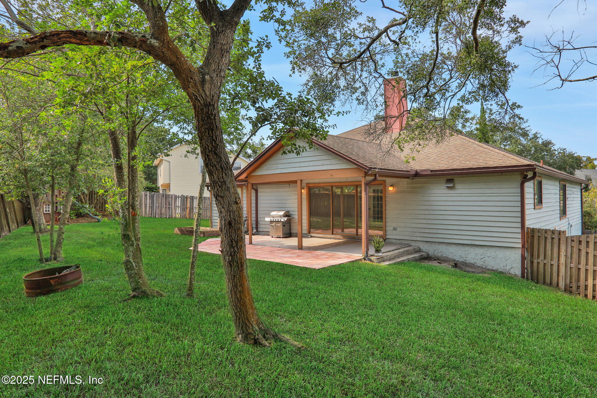12228 Smoke Ridge Circle South Jacksonville, FL 32225 - Photo 48 of 50 a front view of a house with a yard and trees