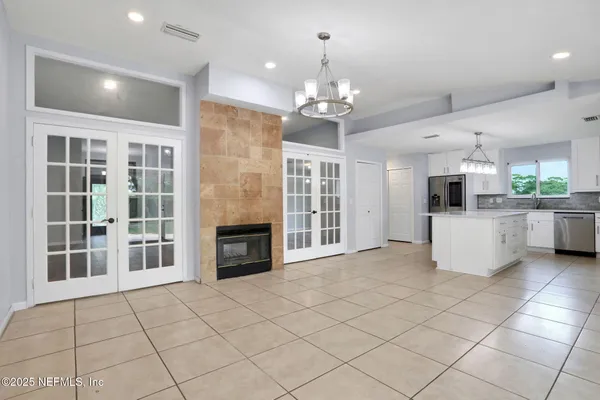 a view of a kitchen with a sink and dishwasher cabinets