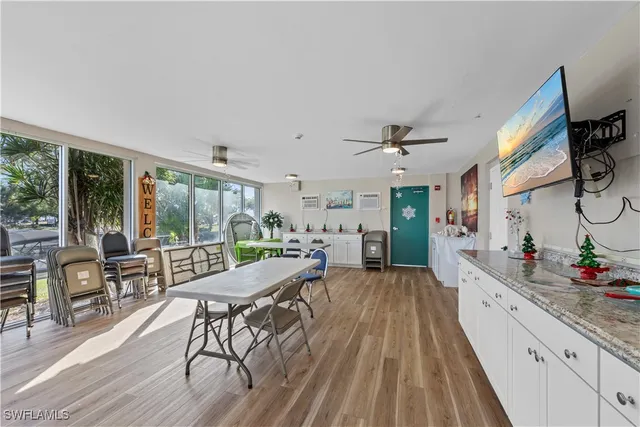a view of a livingroom with furniture wooden floor and a rug