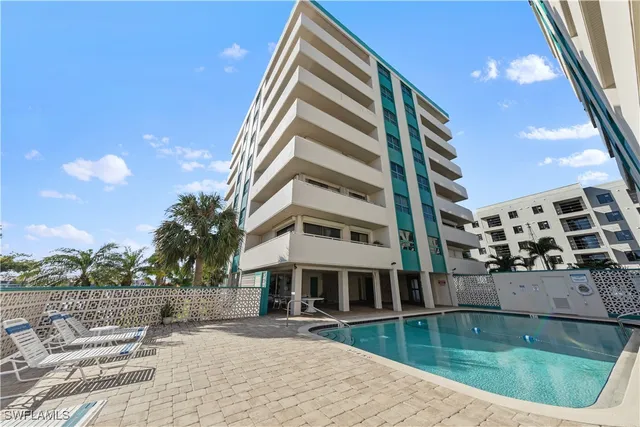 a front view of building with yard