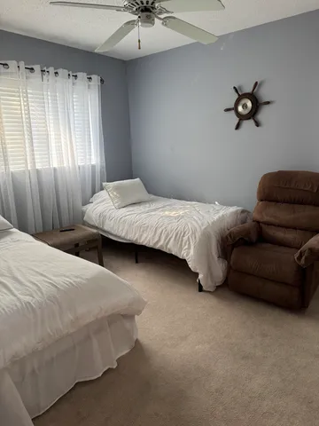 a view of a lake with a house in the background
