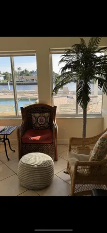 a view of a dining room with furniture window and outside view