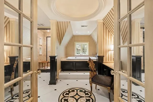 a bedroom with a bed and a fireplace