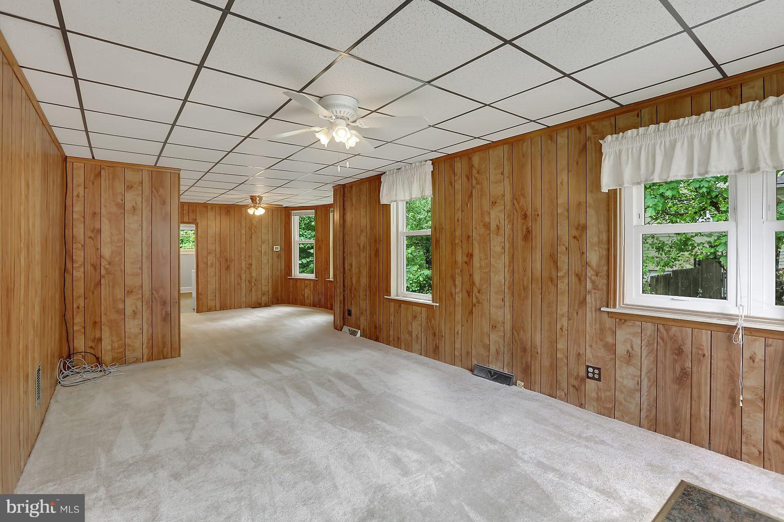 6406 Sherwood Road Baltimore, MD 21239 - Photo 2 of 25 a view of an empty room with a window