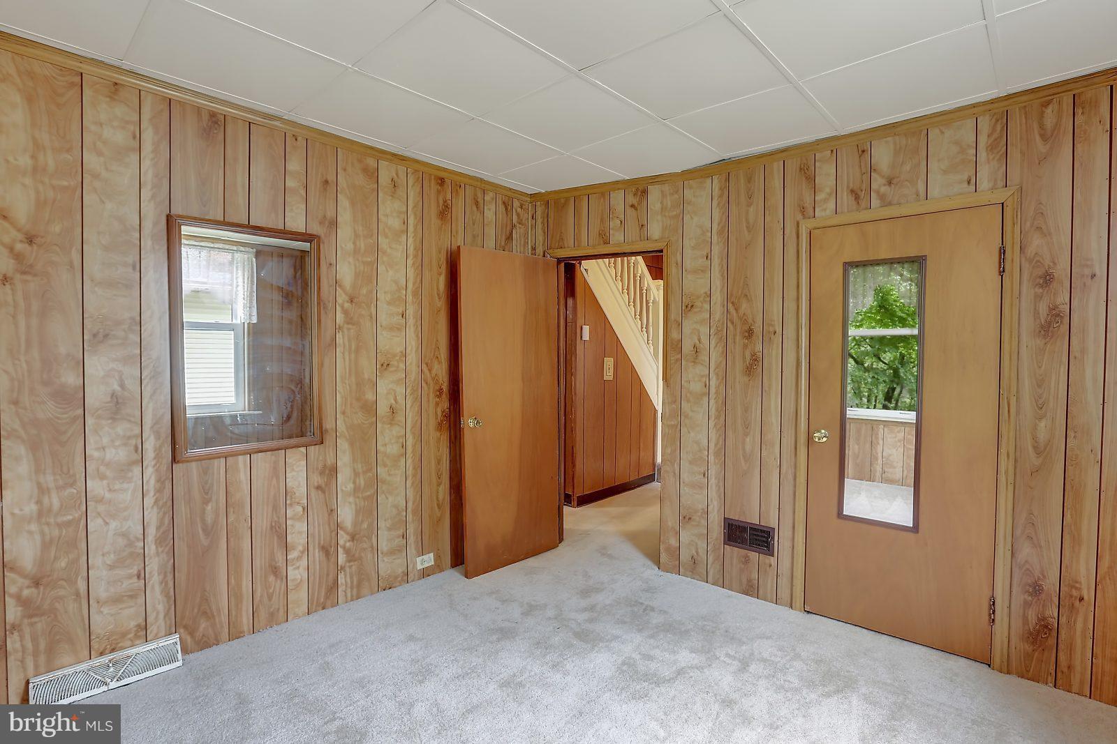 6406 Sherwood Road Baltimore, MD 21239 - Photo 11 of 25 a view of a room with a hallway