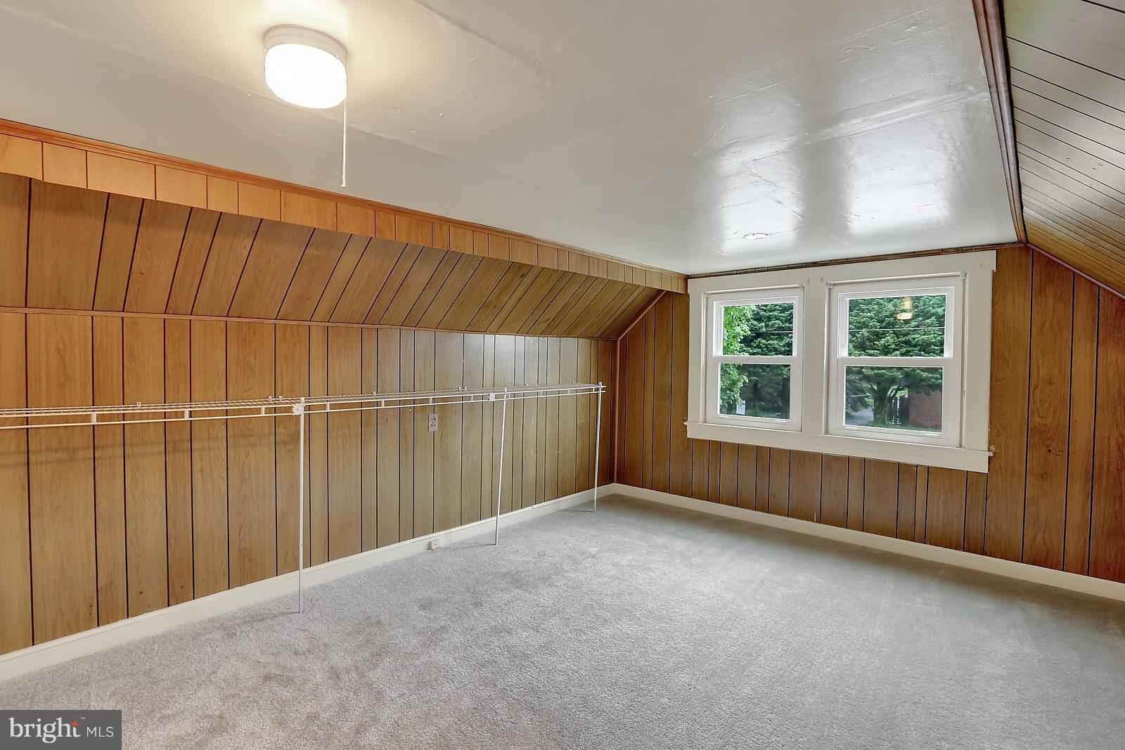 6406 Sherwood Road Baltimore, MD 21239 - Photo 16 of 25 an empty room with windows