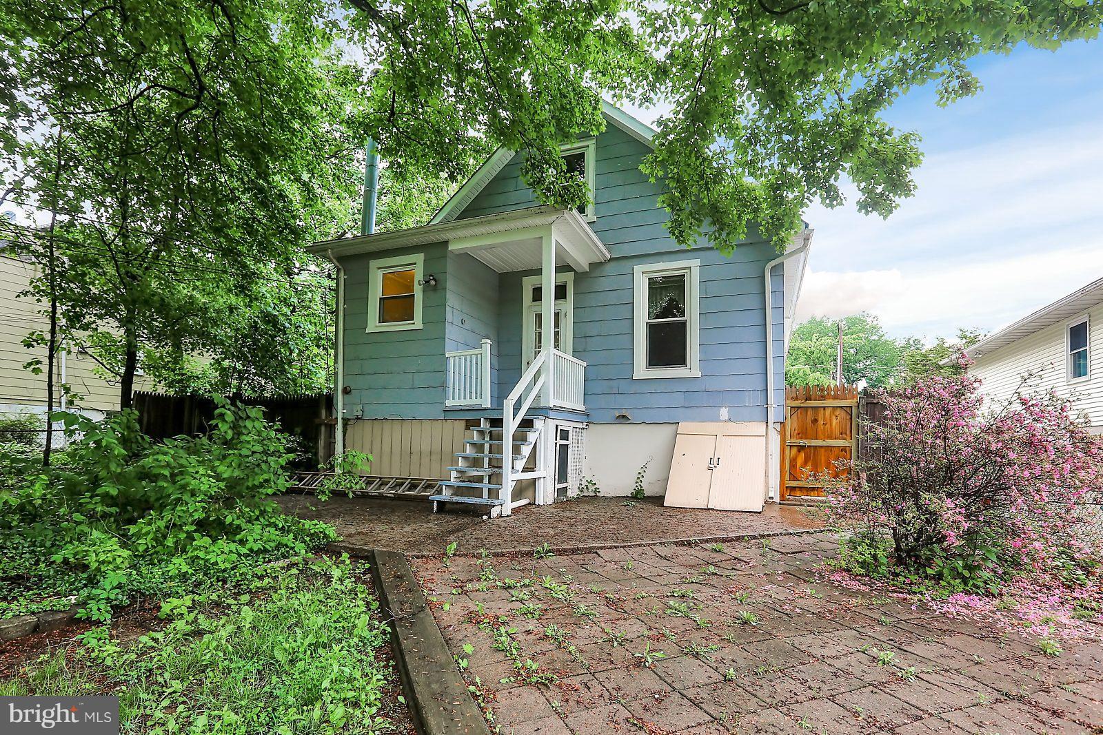6406 Sherwood Road Baltimore, MD 21239 - Photo 23 of 25 a view of a house with a yard