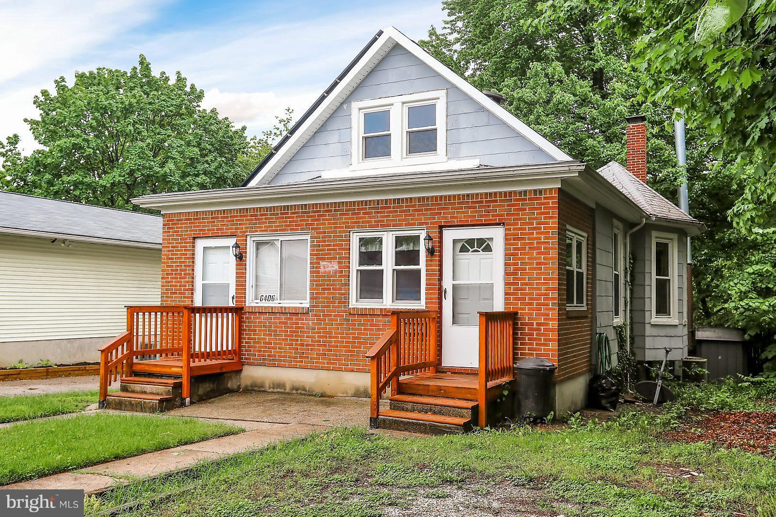 6406 Sherwood Road Baltimore, MD 21239 - Photo 25 of 25 a front view of a house with a yard