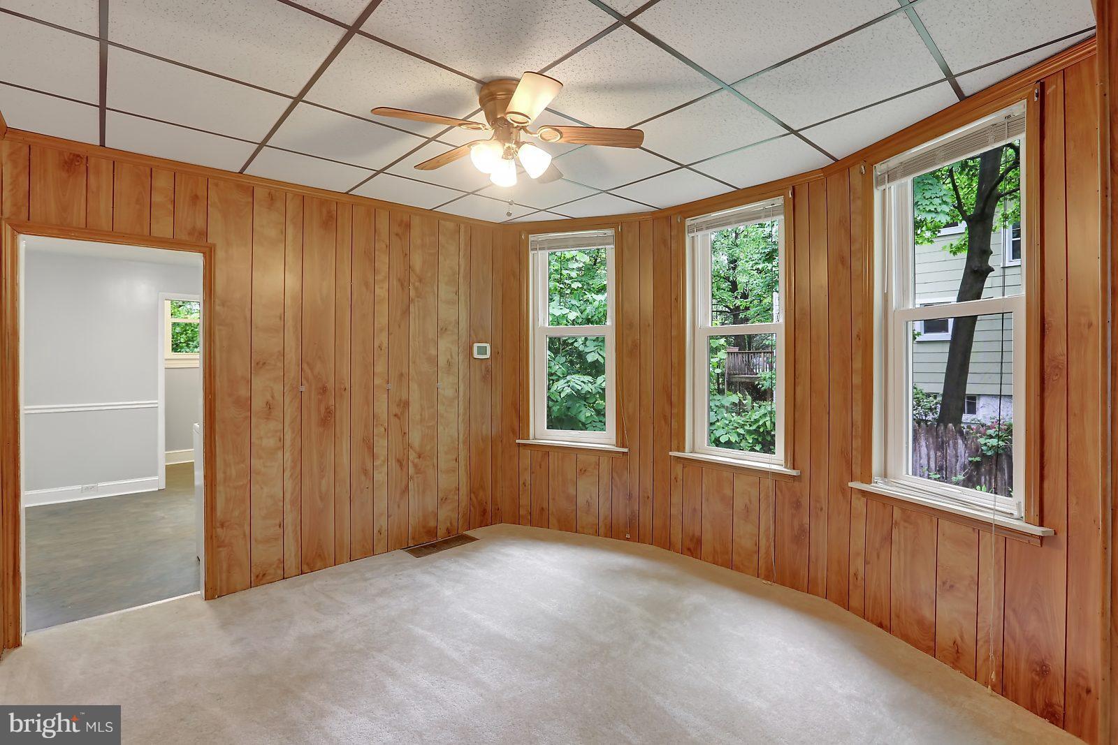 6406 Sherwood Road Baltimore, MD 21239 - Photo 5 of 25 an empty room with windows