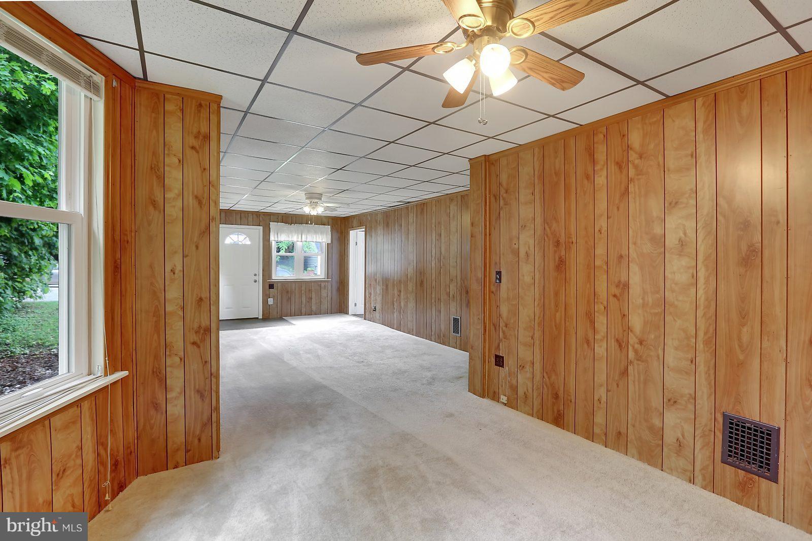 6406 Sherwood Road Baltimore, MD 21239 - Photo 6 of 25 a view of entryway with chandelier and a window