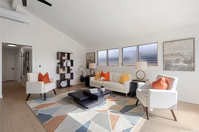 a living room with furniture and a rug