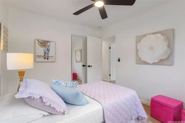 a bedroom with a bed and a lamp