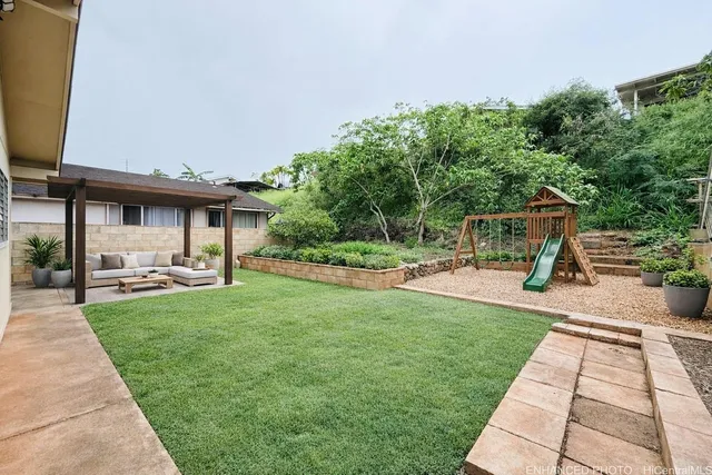 a view of a backyard with sitting area