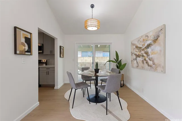 a dining room with furniture and window