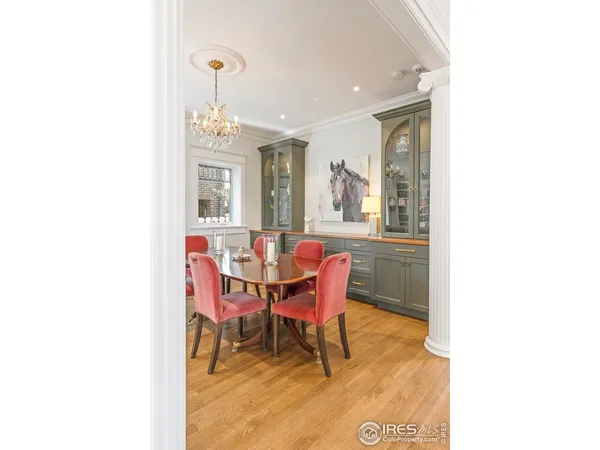 a dining room with a table and chairs