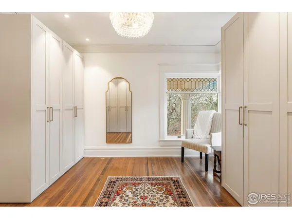 a view of an entryway with wooden floor