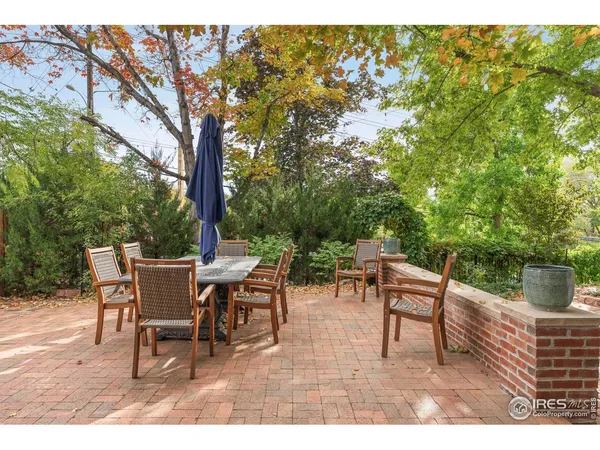a view of a backyard with sitting area