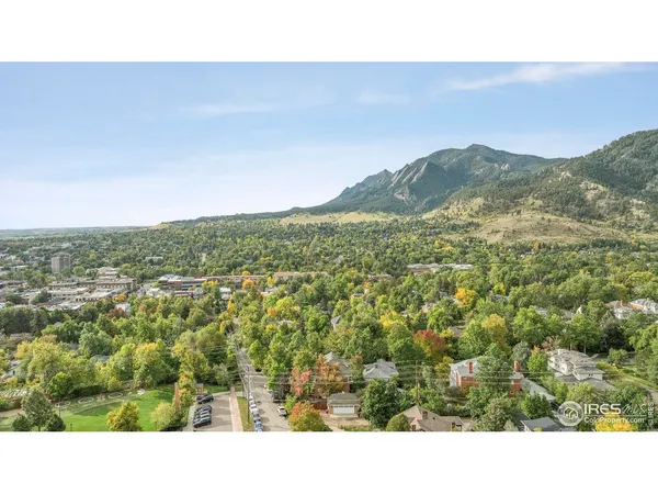 a open area with mountains in the background
