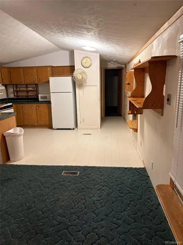 a view of a kitchen with granite countertop a sink