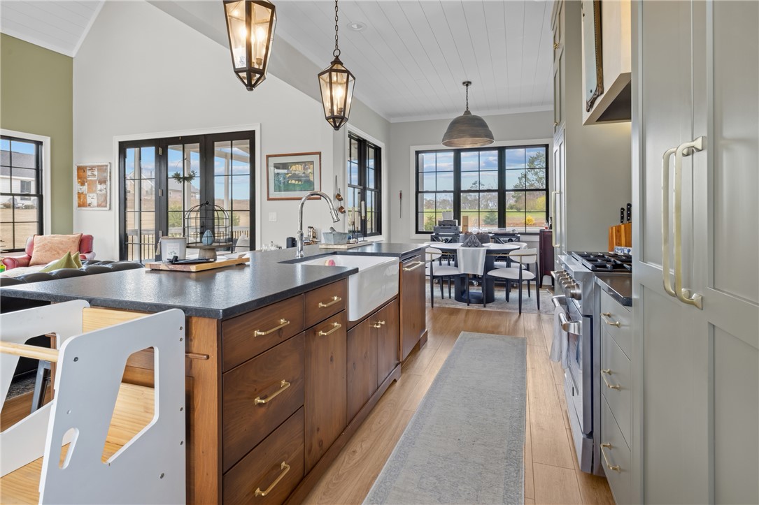 677 Lightwood Road Hartwell, GA 30643 - Photo 13 of 42 This spacious kitchen offers a beautiful blend of natural wood and modern amenities for comfortable living.