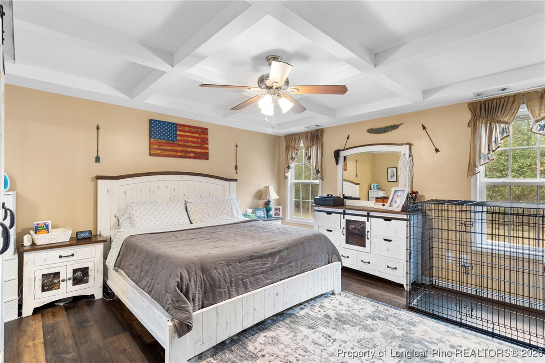 290 Mayor Court Raeford, NC 28376 - Photo 16 of 32 a bedroom with a bed and a chandelier