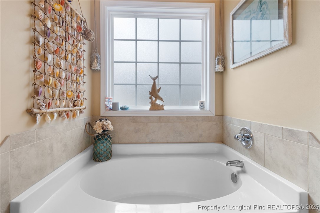 290 Mayor Court Raeford, NC 28376 - Photo 18 of 32 a bathroom with a bathtub