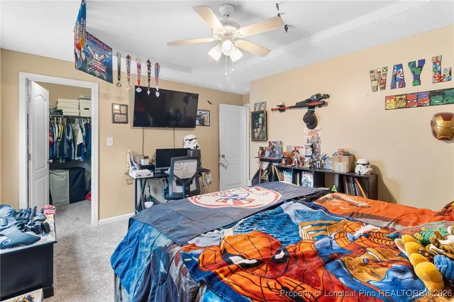 a bathroom with a sink a toilet and shower curtain
