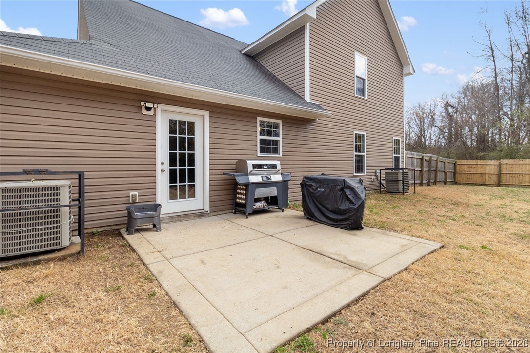 290 Mayor Court Raeford, NC 28376 - Photo 27 of 32 a view of a patio with a table and chairs and a barbeque