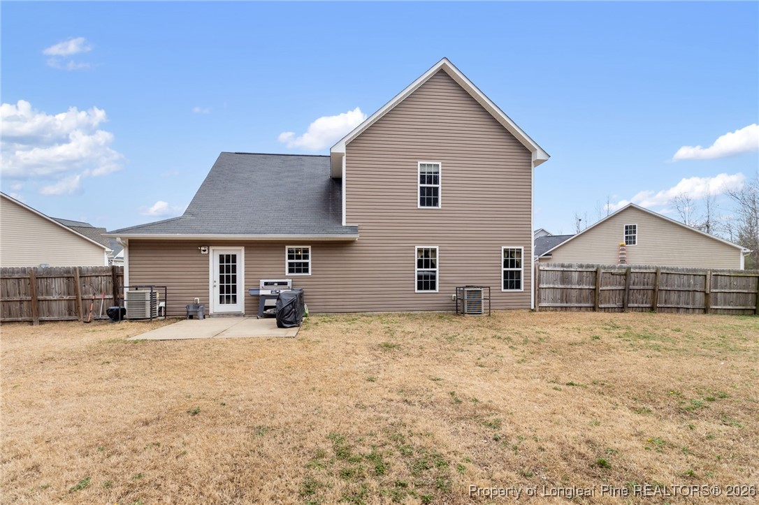 290 Mayor Court Raeford, NC 28376 - Photo 28 of 32 a view of a house with a yard and large trees