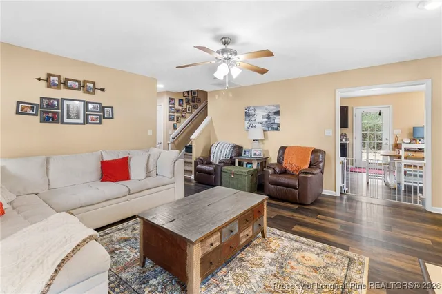 a living room with furniture and a rug
