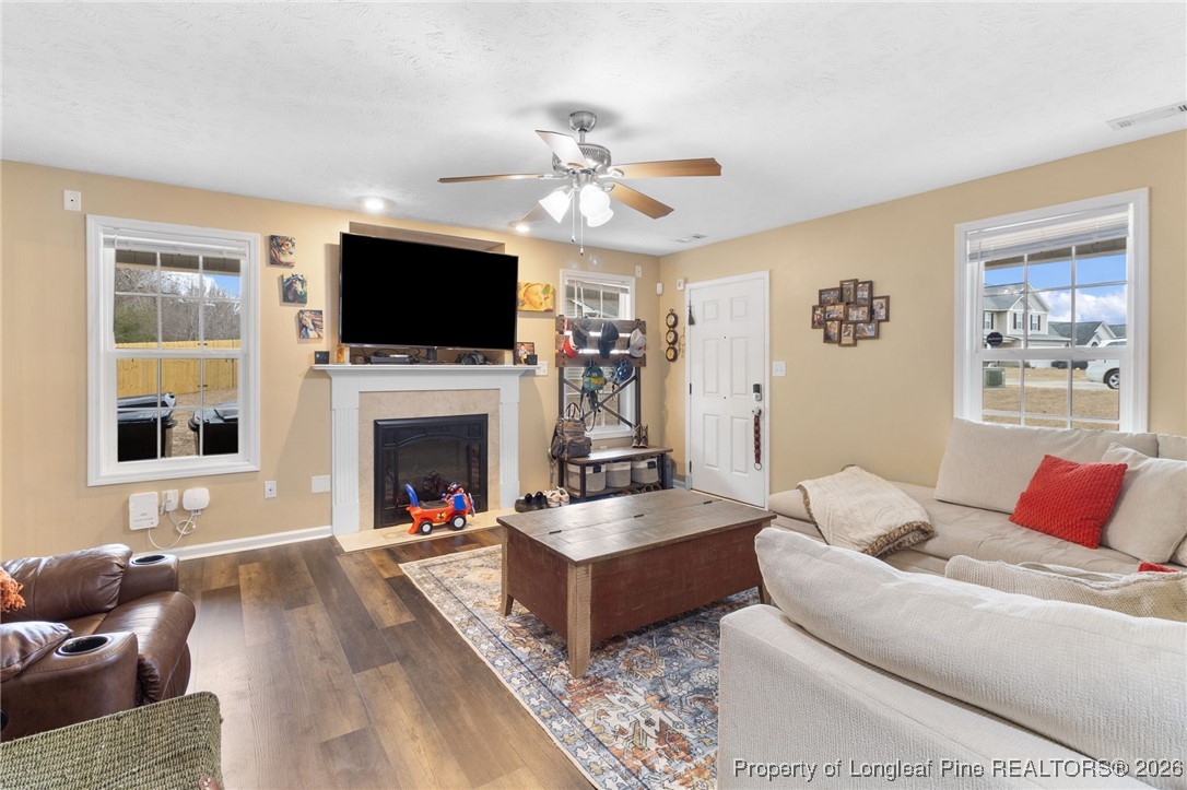 290 Mayor Court Raeford, NC 28376 - Photo 5 of 32 a living room with furniture fireplace and flat screen tv