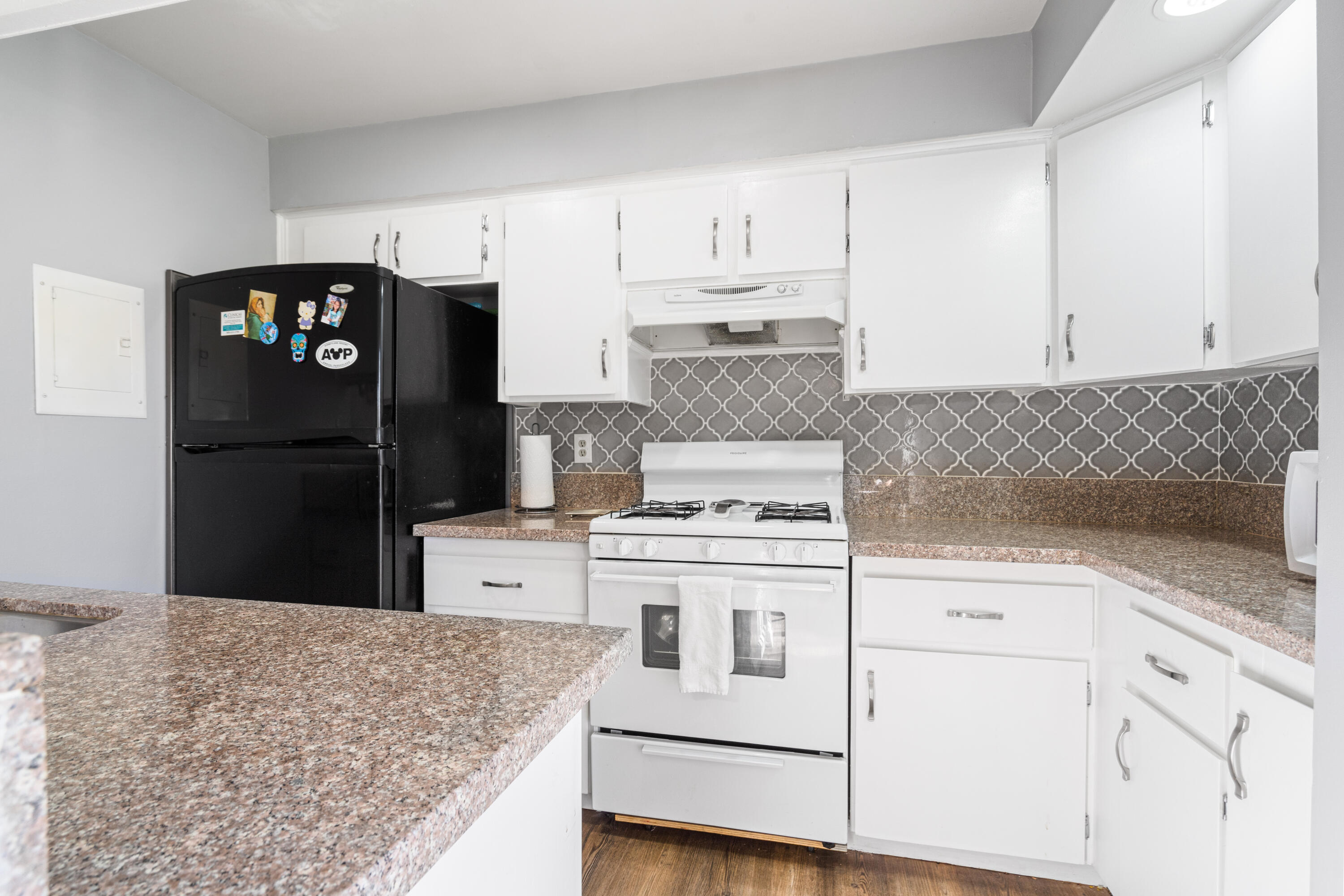 2055 Avenida Placida, Unit 1 Simi Valley, CA 93063 - Photo 12 of 39 a kitchen with white cabinets and refrigerator