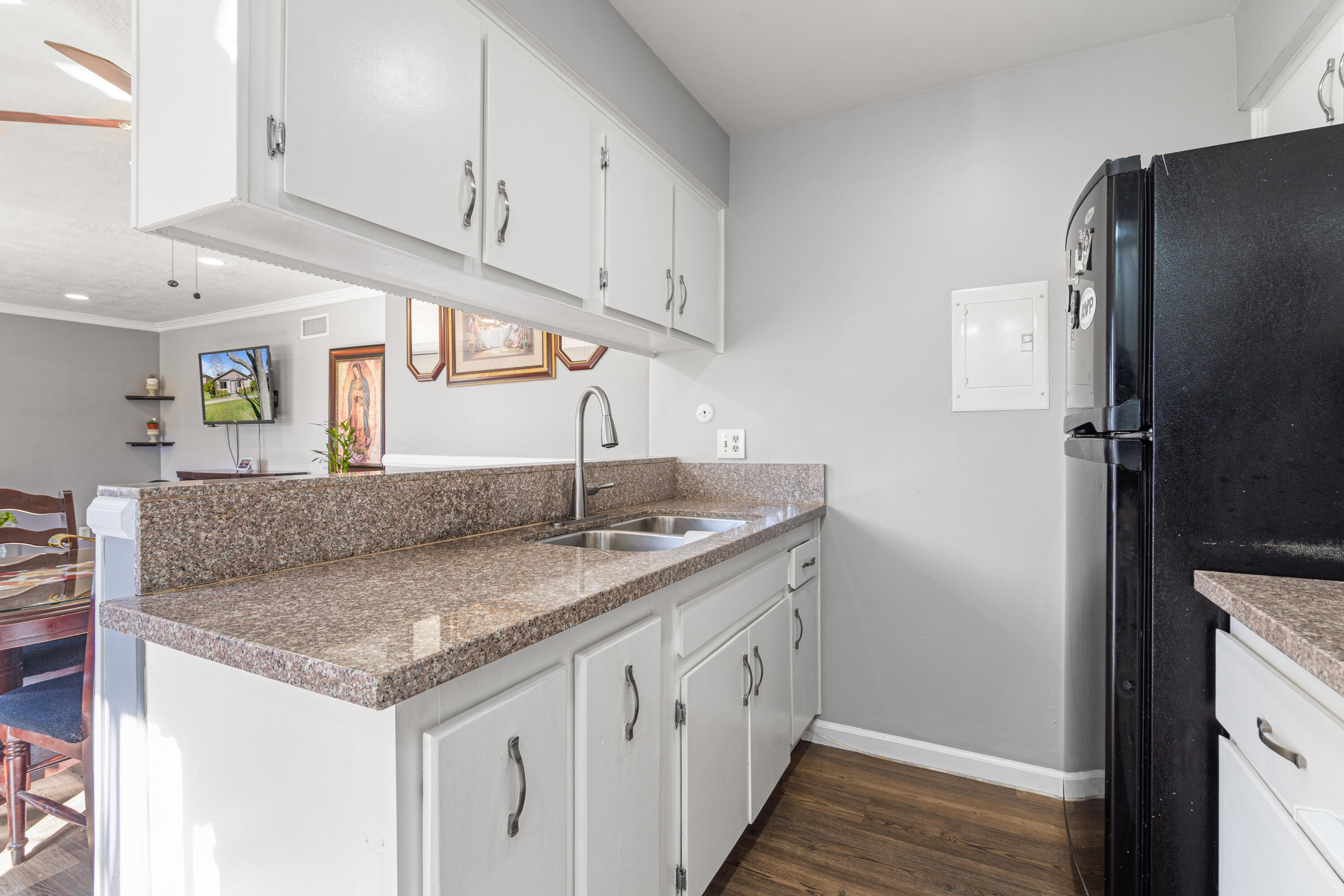 2055 Avenida Placida, Unit 1 Simi Valley, CA 93063 - Photo 13 of 39 a kitchen with stainless steel appliances granite countertop a sink and a refrigerator