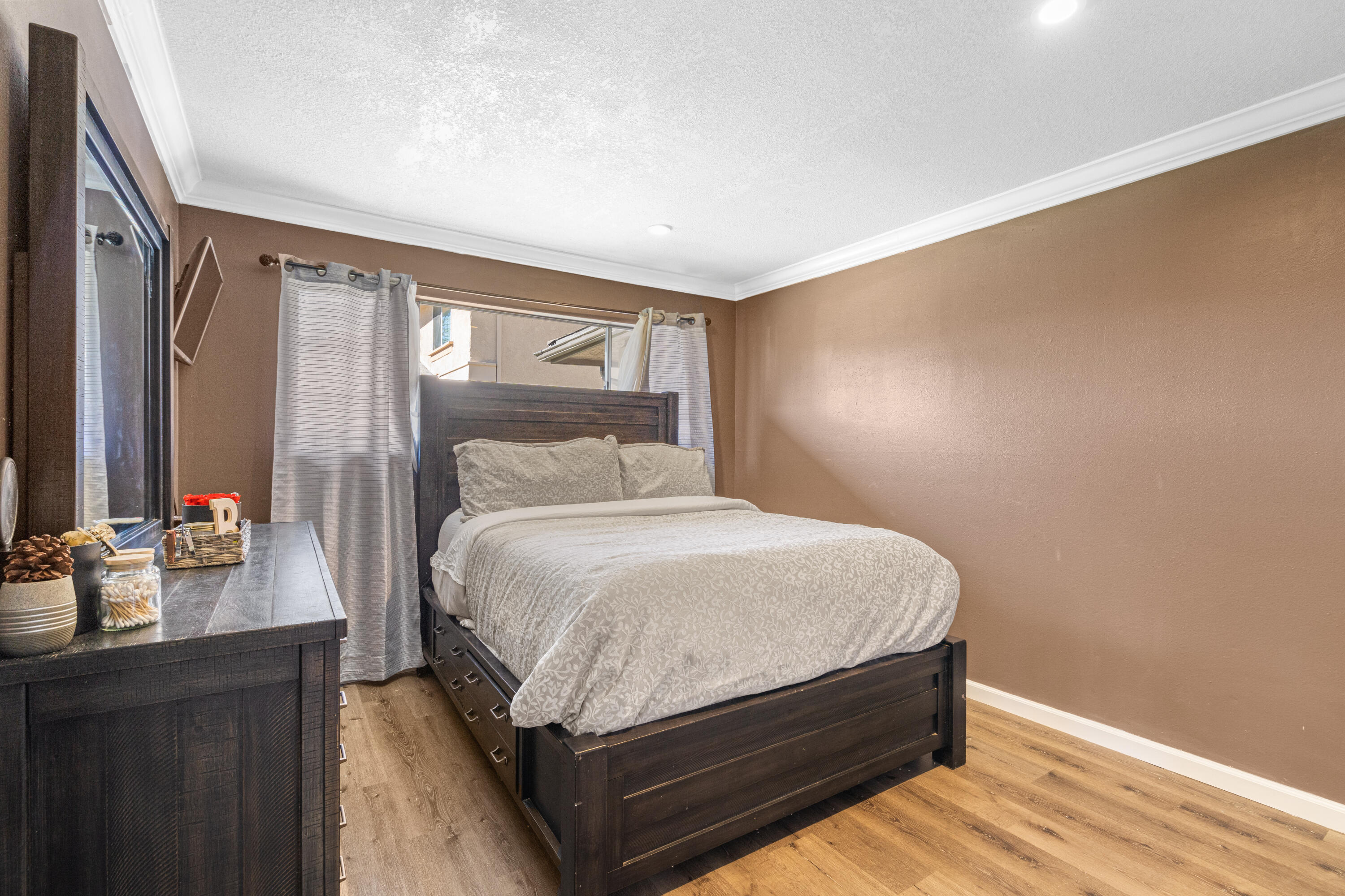 2055 Avenida Placida, Unit 1 Simi Valley, CA 93063 - Photo 17 of 39 a bedroom with a bed and wooden floor