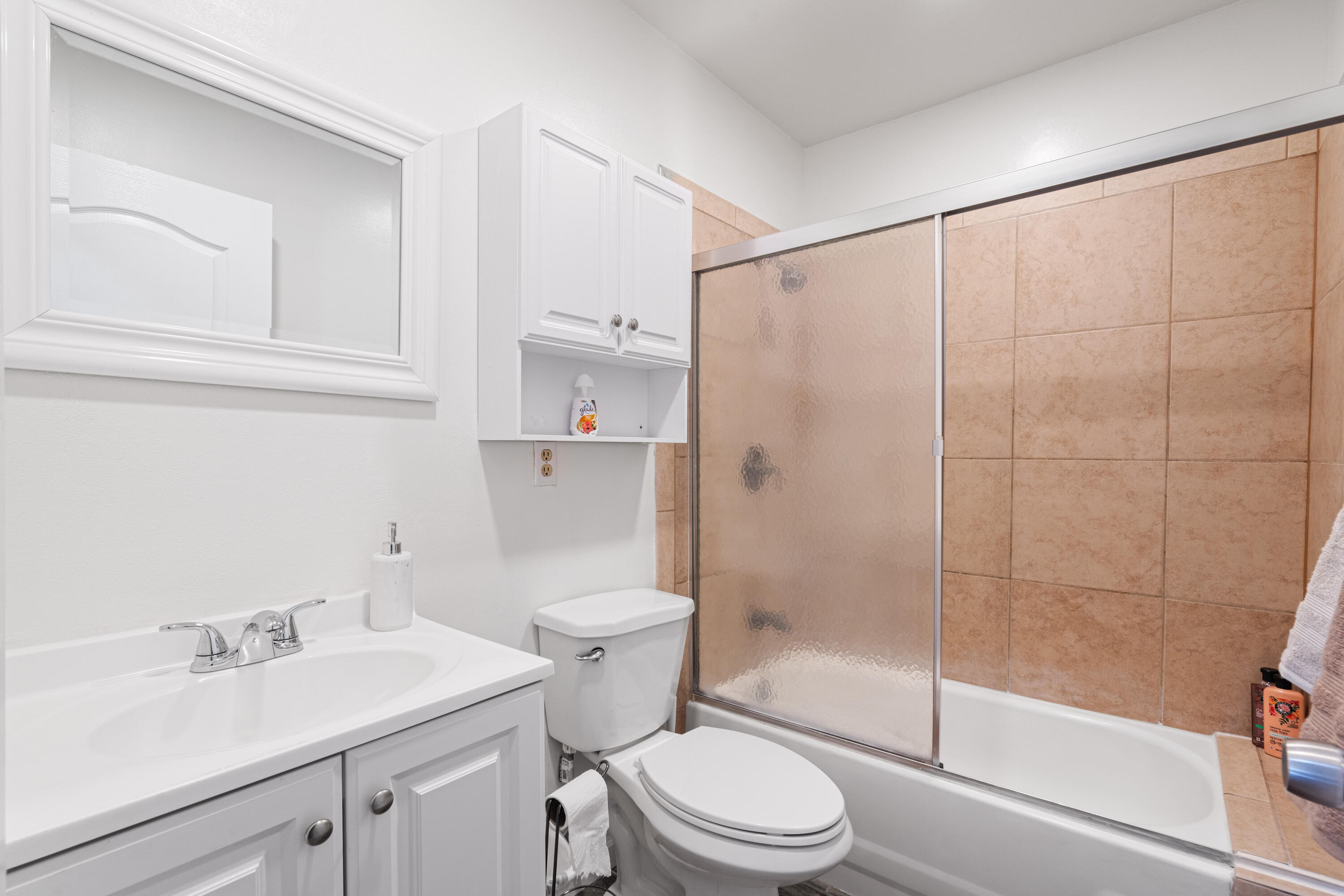 2055 Avenida Placida, Unit 1 Simi Valley, CA 93063 - Photo 19 of 39 a bathroom with a sink a toilet and shower