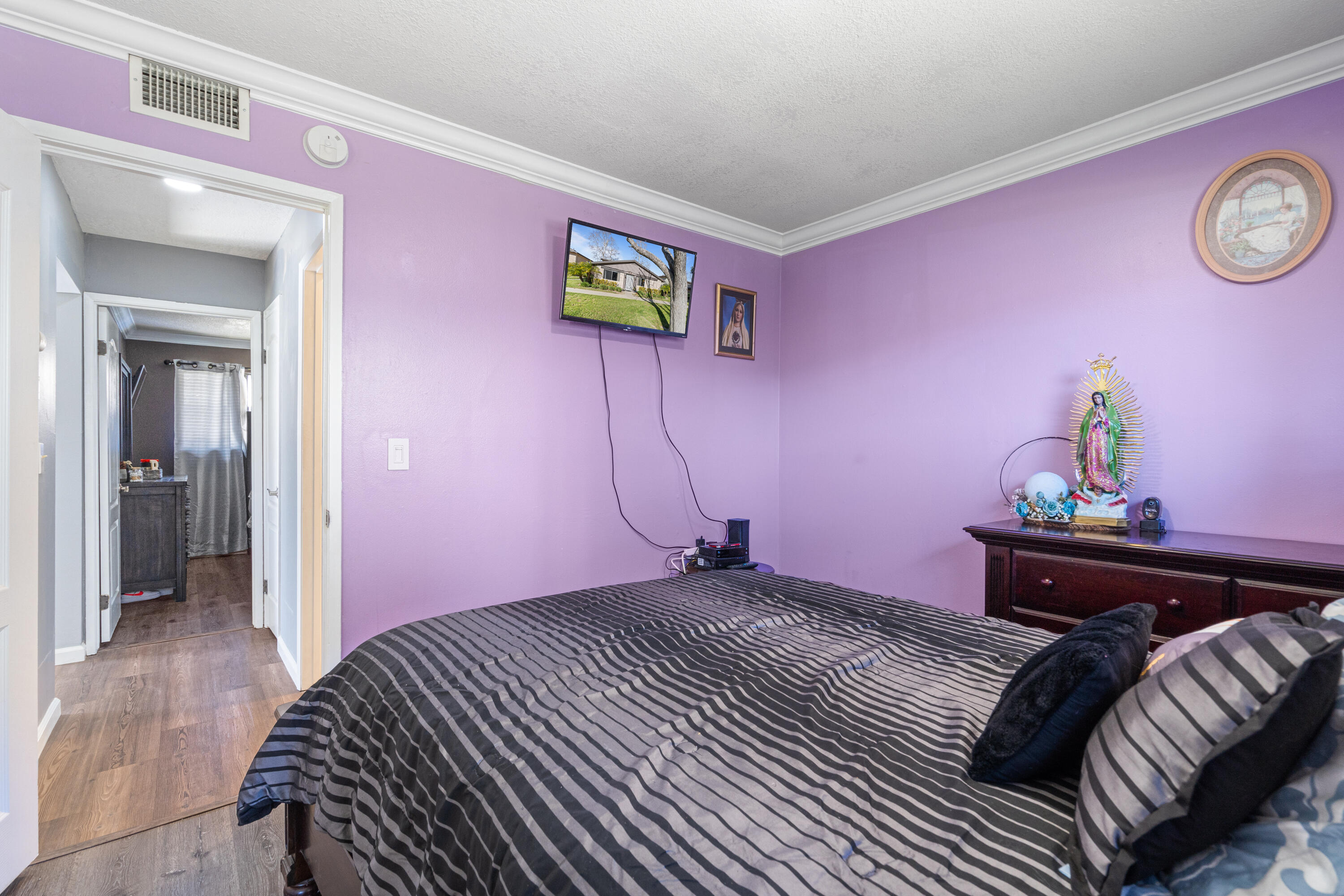 2055 Avenida Placida, Unit 1 Simi Valley, CA 93063 - Photo 20 of 39 a bedroom with a bed and hallway
