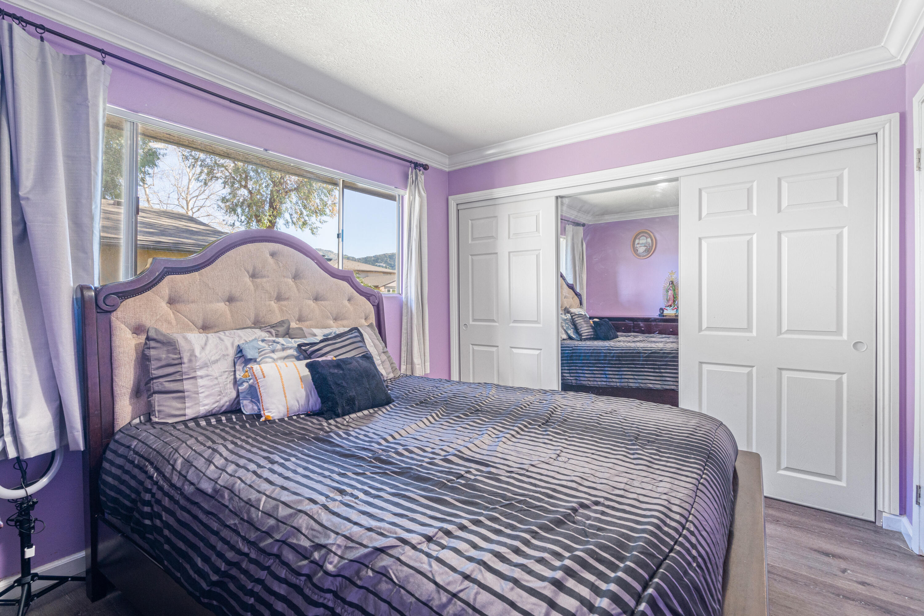 2055 Avenida Placida, Unit 1 Simi Valley, CA 93063 - Photo 21 of 39 a bedroom with a bed and wooden floor
