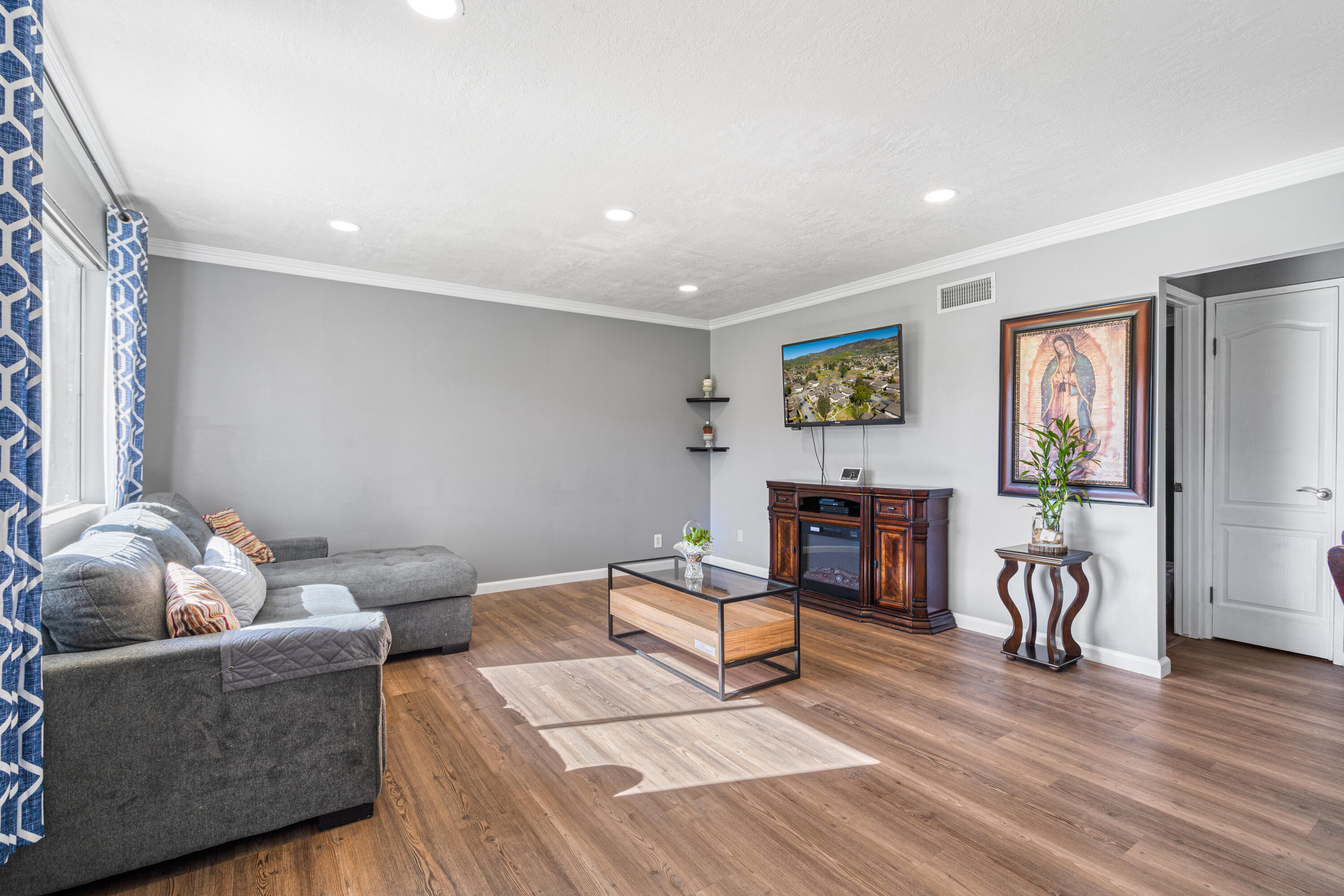 2055 Avenida Placida, Unit 1 Simi Valley, CA 93063 - Photo 4 of 39 a living room with furniture and wooden floor