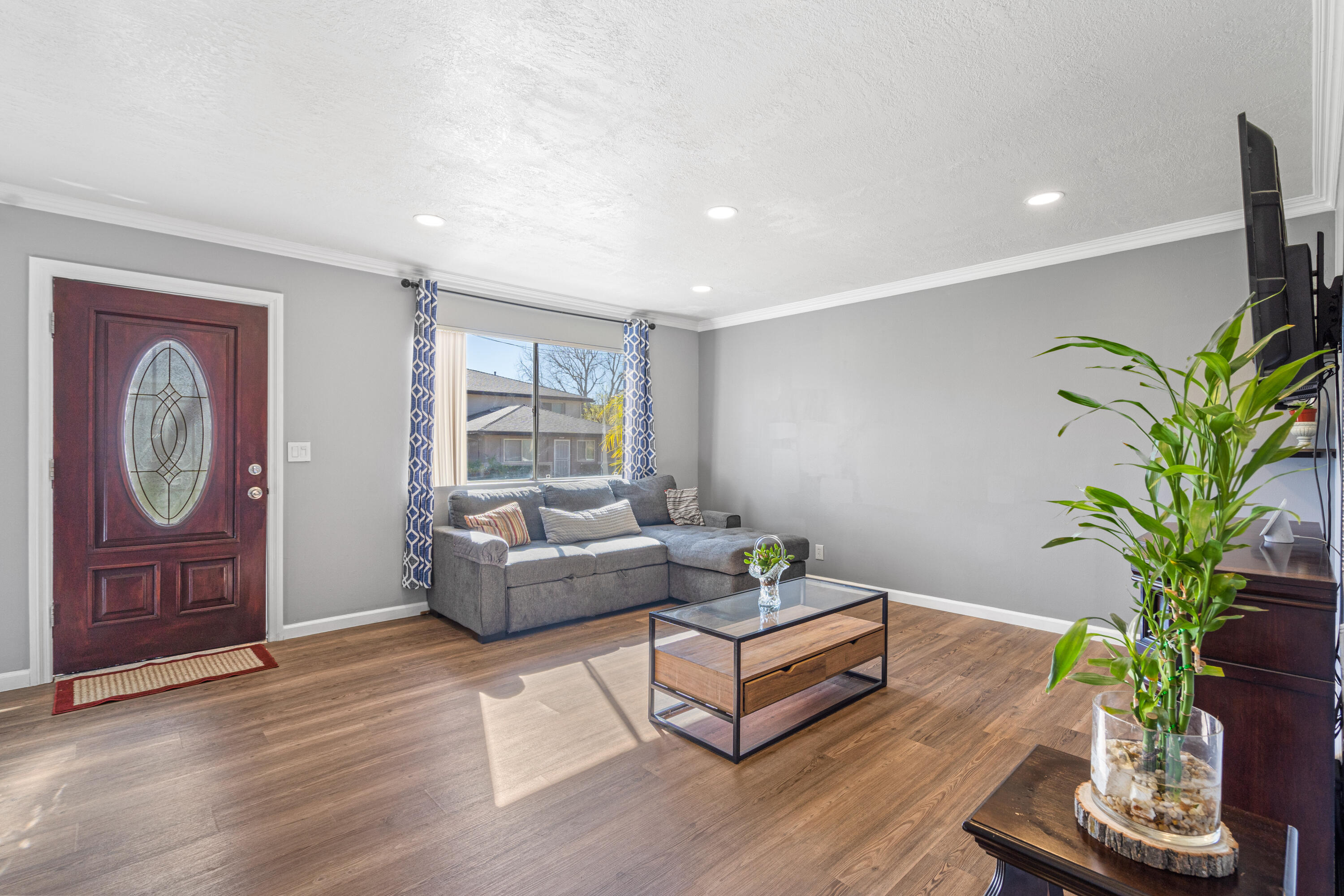 2055 Avenida Placida, Unit 1 Simi Valley, CA 93063 - Photo 5 of 39 a living room with furniture a potted plant and a window