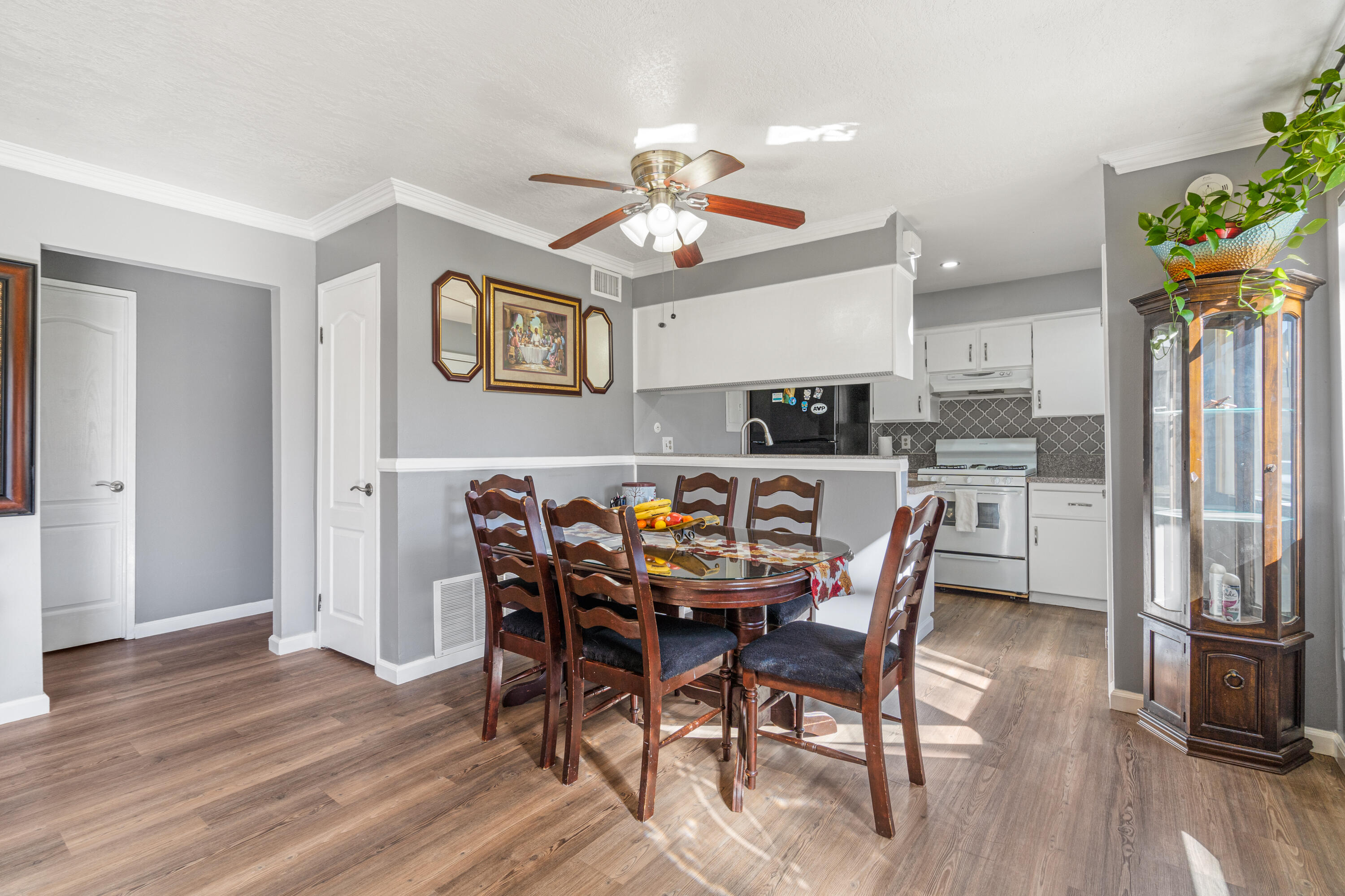 2055 Avenida Placida, Unit 1 Simi Valley, CA 93063 - Photo 9 of 39 a view of a dining room with furniture and a chandelier