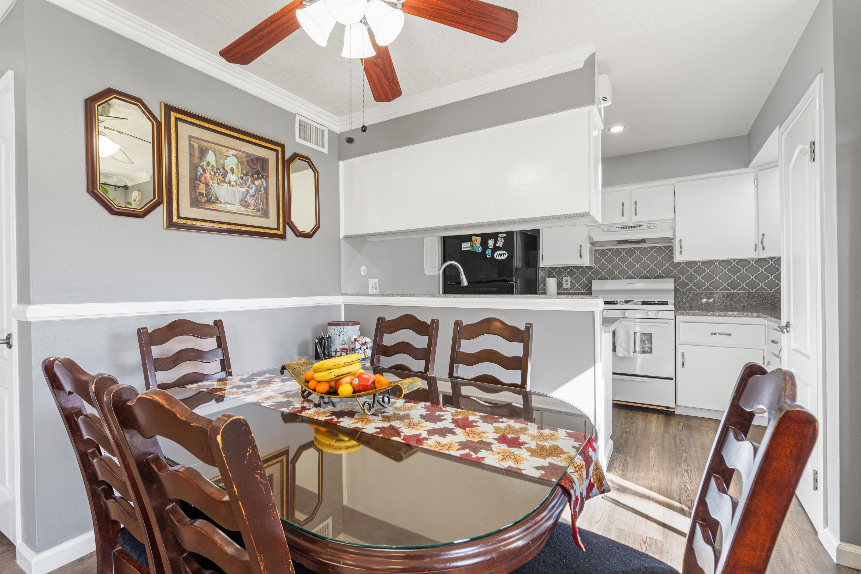 2055 Avenida Placida, Unit 1 Simi Valley, CA 93063 - Photo 10 of 39 a kitchen with stainless steel appliances granite countertop a stove a dining table and chairs