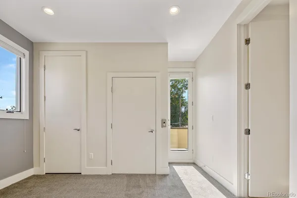 a bathroom with a sink a toilet a shower and a mirror