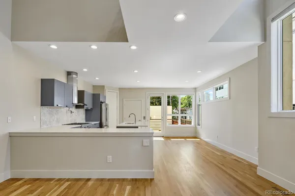 a view of kitchen with kitchen island refrigerator sink and stove