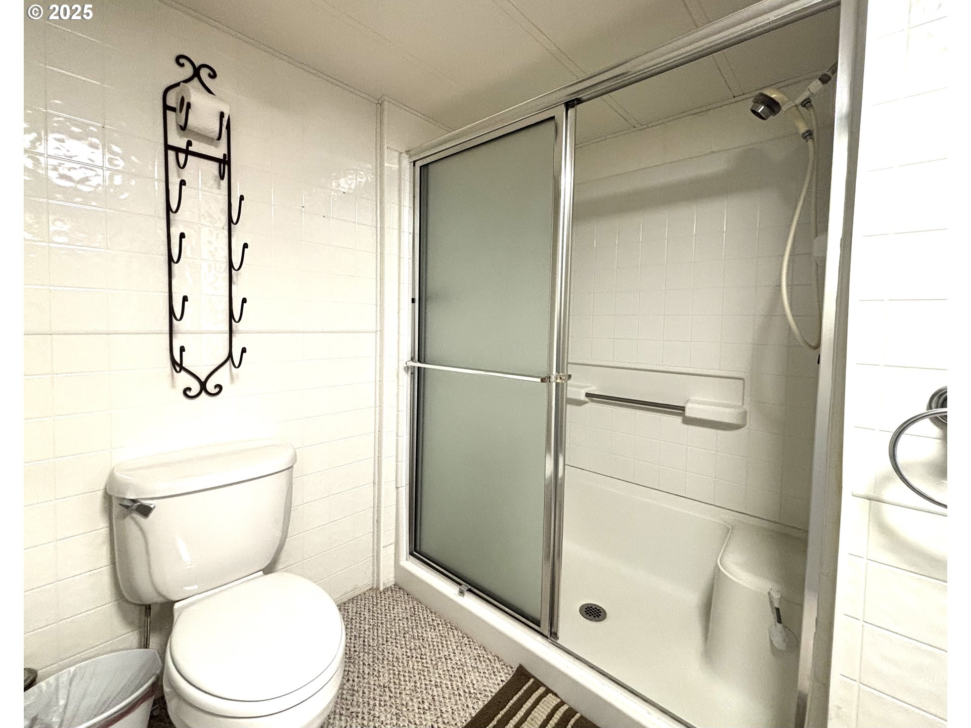 1600 Rhododendron Drive, Unit 29 Florence, OR 97439 - Photo 22 of 35 a bathroom with a toilet and a shower